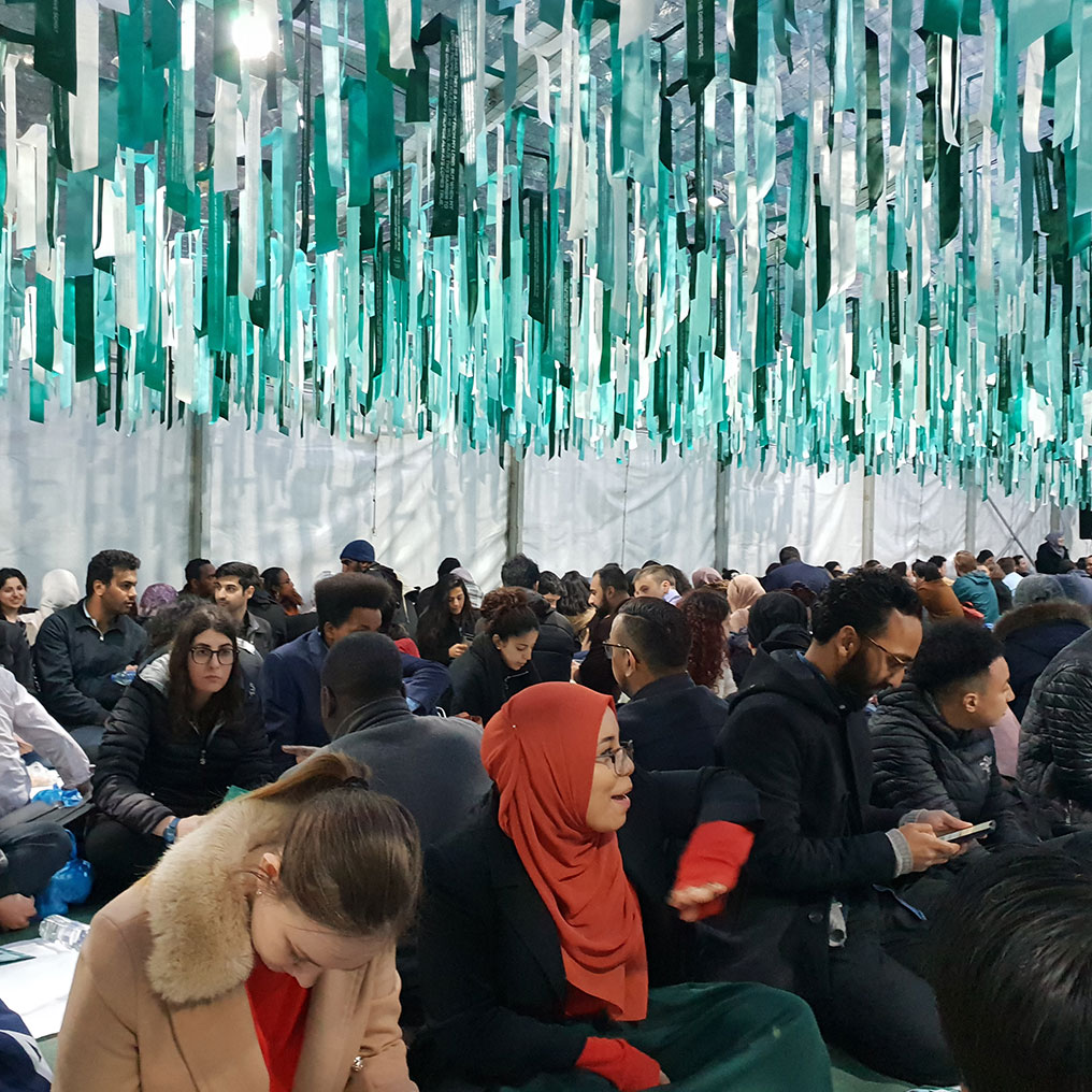 People sitting in Ramadan tent Project