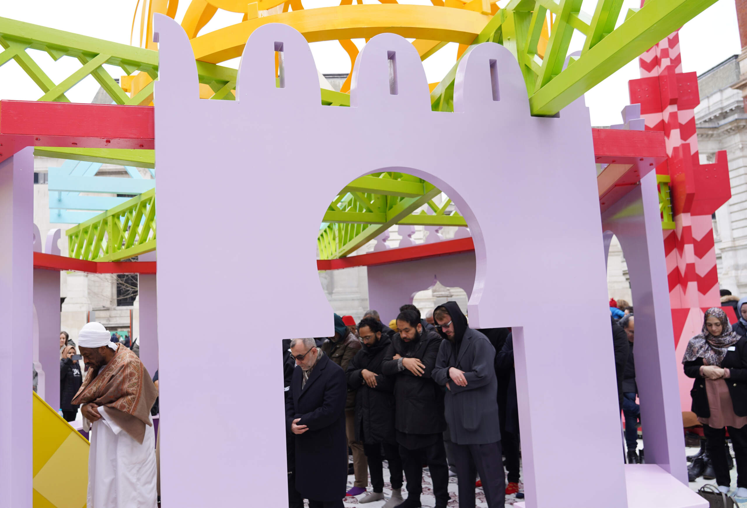 People offering prayer inside the "Ramadan Pavilion" at London's V&A