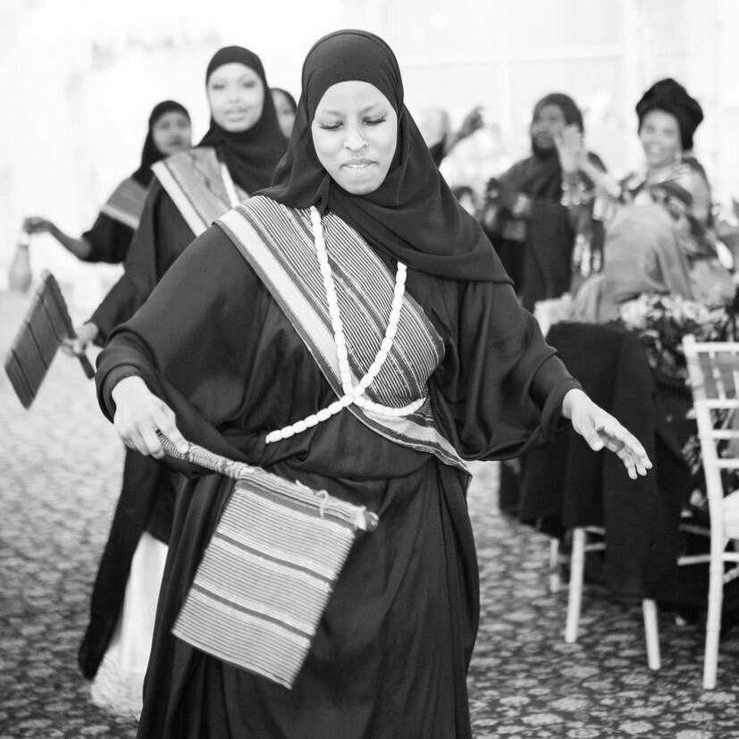 A black n white picture of ladies wearing burka .